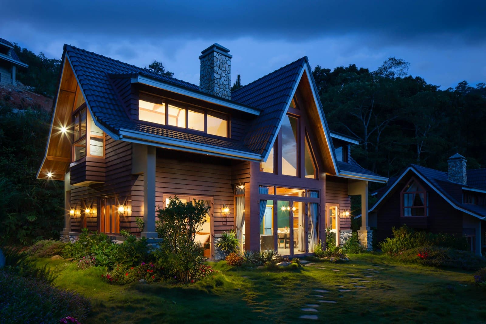 A stately Lowcountry home glowing at dusk